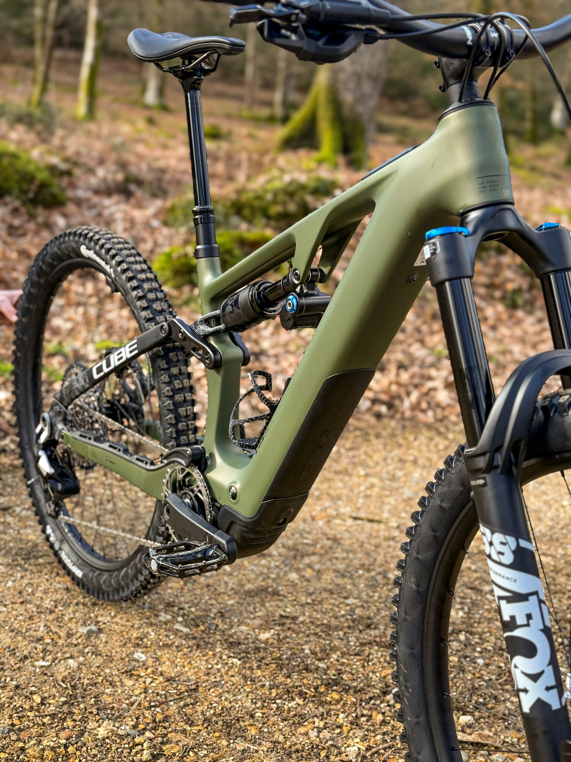 cube ams hybrid one77 c:62 tm 600x demo bike in forest setting
